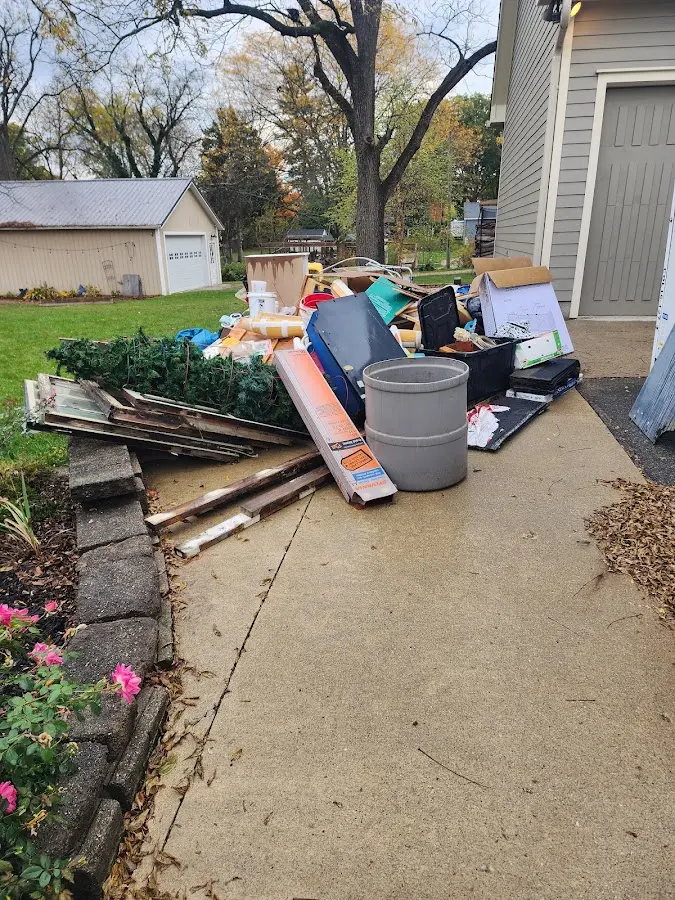 Dumpster being loaded with debris for Roofing Dumpster Rental in Galax